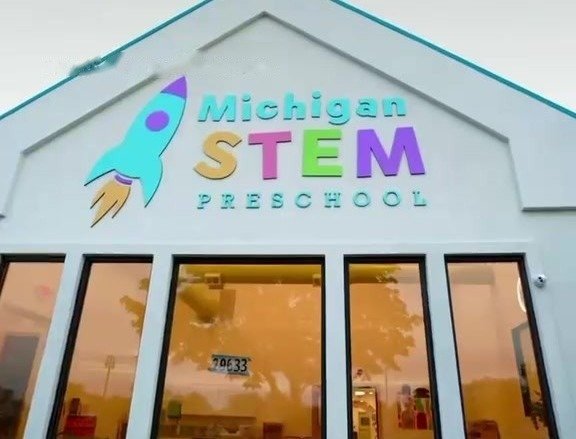 The front of Michigan STEM Preschool on Ford Road with the rocket logo sign